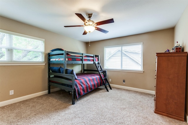 1117 Brandy Sta, Richardson, TX 75080 - bedroom featuring multiple windows, carpet flooring, and baseboards