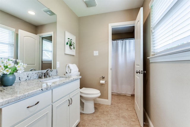 1117 Brandy Sta, Richardson, TX 75080 - bathroom featuring toilet, baseboards, vanity, and tile patterned floors