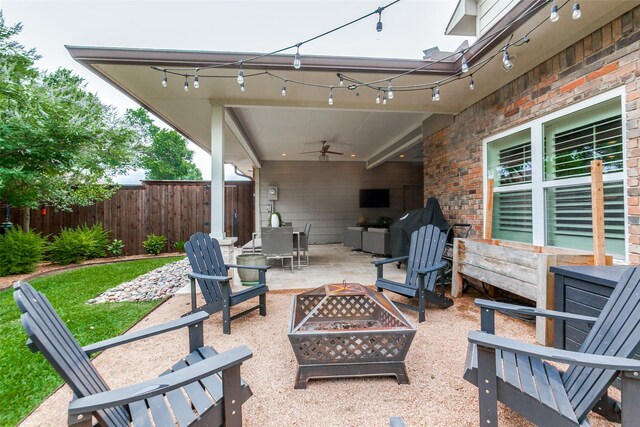 1117 Brandy Sta, Richardson, TX 75080 - view of patio / terrace with a fire pit, ceiling fan, and outdoor dining area