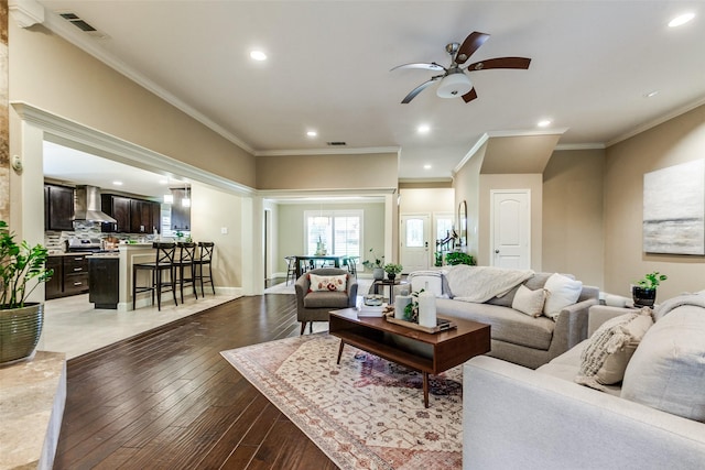 1117 Brandy Sta, Richardson, TX 75080 - living area featuring a ceiling fan, recessed lighting, light wood-style floors, and ornamental molding