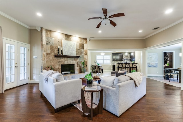 1117 Brandy Sta, Richardson, TX 75080 - living area featuring a stone fireplace, ornamental molding, a ceiling fan, dark wood-type flooring, and recessed lighting