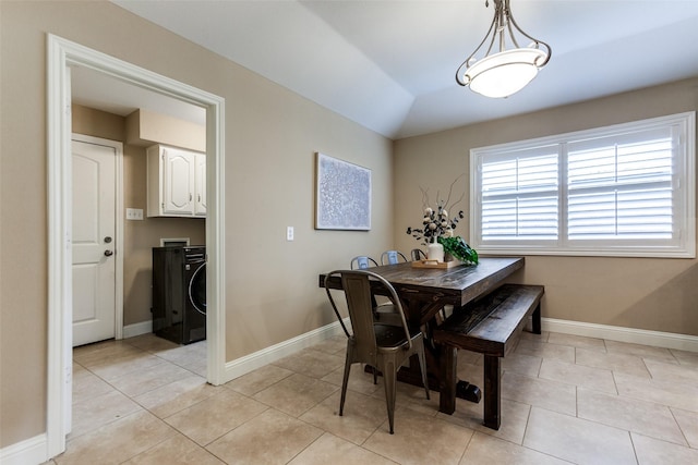 1117 Brandy Sta, Richardson, TX 75080 - dining space with light tile patterned floors, baseboards, washer / clothes dryer, and lofted ceiling