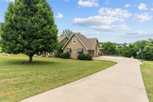 415 Stone Mountain Ct, Cresson, TX 76035 - view of front of house featuring concrete driveway, a front yard, roof with shingles, and a garage