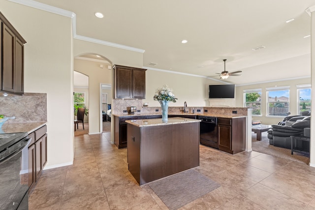 8400 Sioux Trl, Aubrey, TX 76227 - kitchen featuring black appliances, crown molding, arched walkways, a center island, and dark brown cabinets