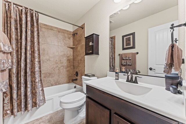 8400 Sioux Trl, Aubrey, TX 76227 - full bath with shower / bath combination with curtain, toilet, vanity, a textured wall, and tile patterned flooring