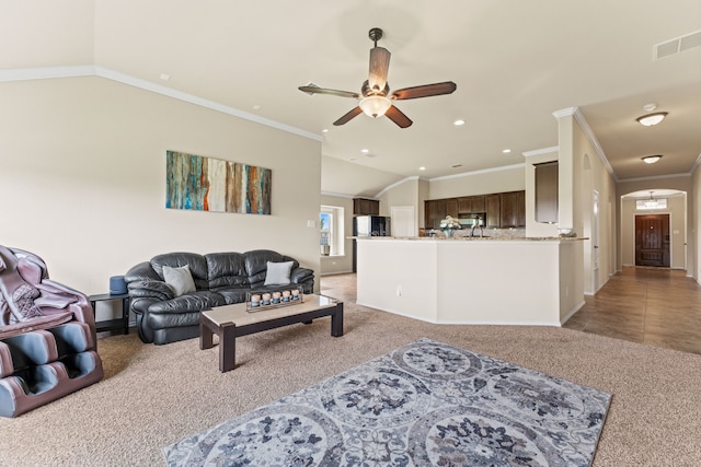 8400 Sioux Trl, Aubrey, TX 76227 - living area with light carpet, a ceiling fan, ornamental molding, baseboards, and recessed lighting