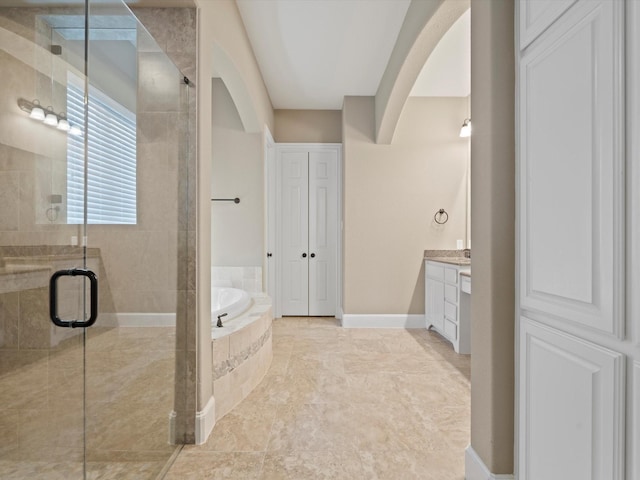 897 Clear Water Dr, Allen, TX 75013 - full bathroom with a garden tub, a stall shower, vanity, and baseboards