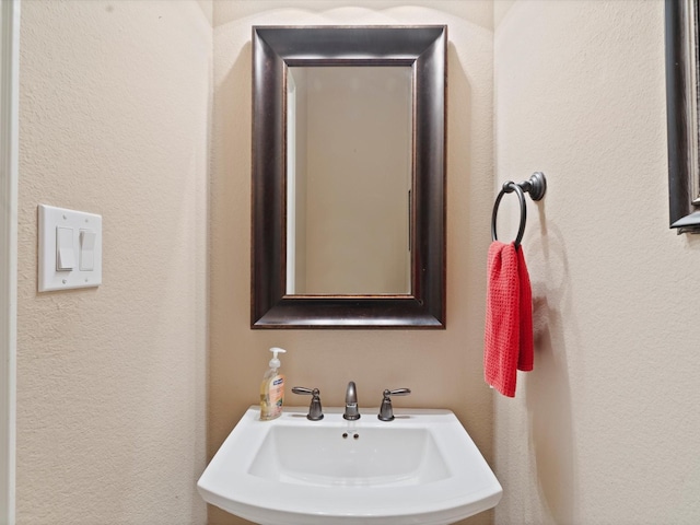 897 Clear Water Dr, Allen, TX 75013 - bathroom featuring a sink and a textured wall