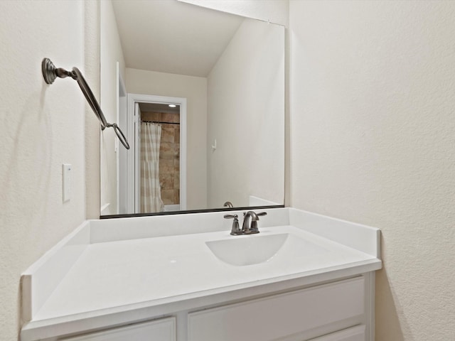 897 Clear Water Dr, Allen, TX 75013 - bathroom with vanity, a textured wall, and a shower with shower curtain