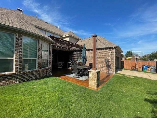 897 Clear Water Dr, Allen, TX 75013 - back of property with a pergola, brick siding, and a patio area
