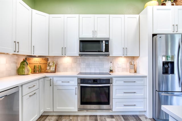 10108 Hunter Run, Frisco, TX 75035 - kitchen with appliances with stainless steel finishes, light countertops, and white cabinets