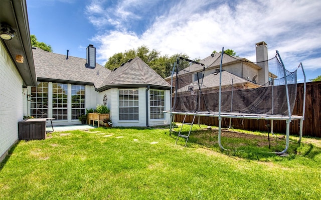 10108 Hunter Run, Frisco, TX 75035 - view of yard featuring a trampoline