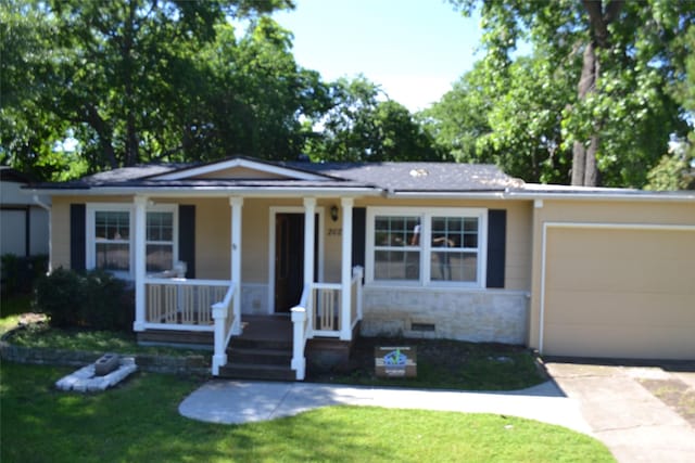 202 Pine St, Arlington, TX 76011 - view of front of property with covered porch, an attached garage, stone siding, concrete driveway, and a front yard