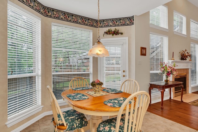 3916 Navajo Ln, Bedford, TX 76021 - dining area with light tile patterned floors, baseboards, and plenty of natural light