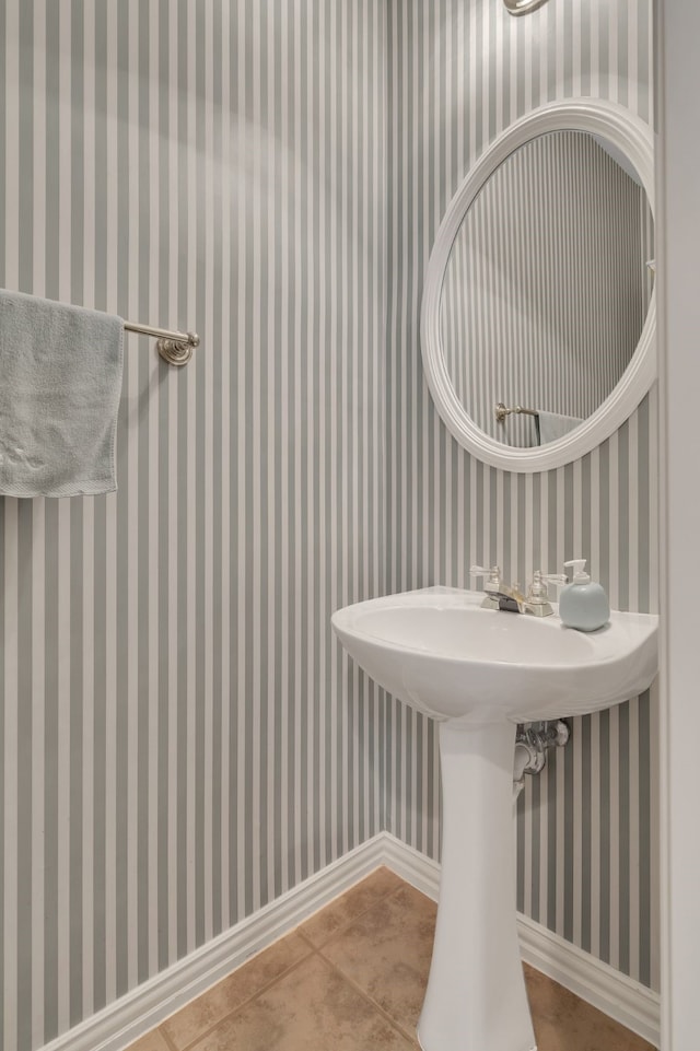 3916 Navajo Ln, Bedford, TX 76021 - bathroom featuring wallpapered walls, concrete flooring, and a sink