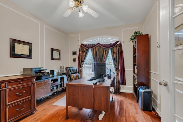 3916 Navajo Ln, Bedford, TX 76021 - office space with a ceiling fan, light wood-style flooring, and a decorative wall
