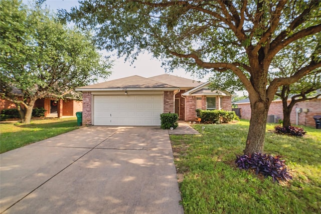 2949 Stockton St, Denton, TX 76209 - ranch-style house with a garage, concrete driveway, a front yard, and brick siding