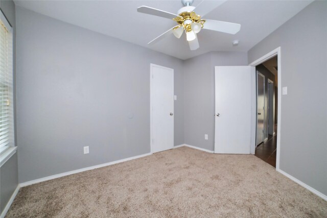 2949 Stockton St, Denton, TX 76209 - unfurnished bedroom featuring carpet floors, baseboards, and a ceiling fan