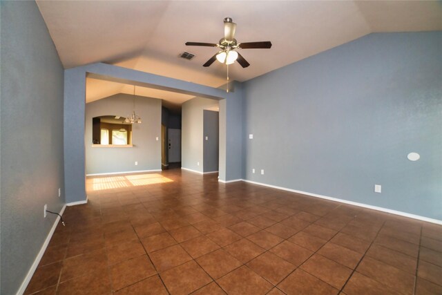 2949 Stockton St, Denton, TX 76209 - spare room featuring lofted ceiling, a ceiling fan, tile patterned floors, and a chandelier