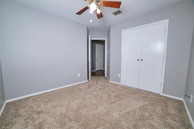 2949 Stockton St, Denton, TX 76209 - unfurnished bedroom featuring carpet, baseboards, a closet, and a ceiling fan