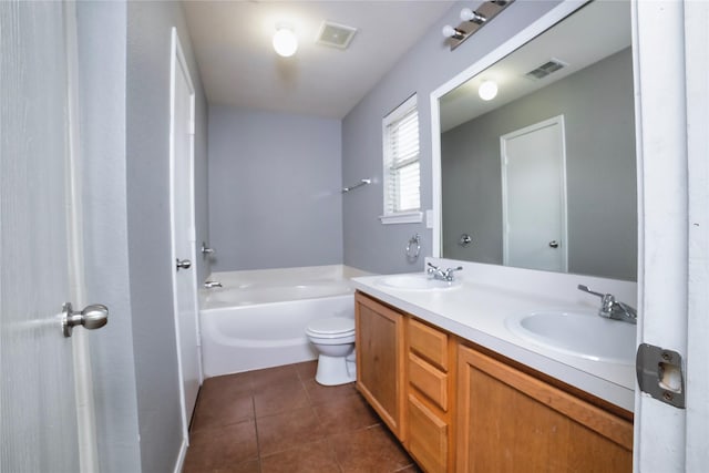 2949 Stockton St, Denton, TX 76209 - full bath with tile patterned floors, a bath, double vanity, and toilet