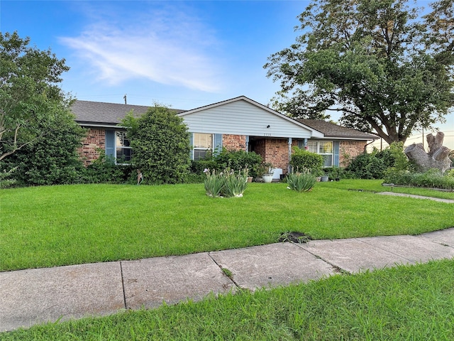 2725 Rustown Dr, Mesquite, TX 75150 - ranch-style home featuring brick siding, a front lawn, and a shingled roof