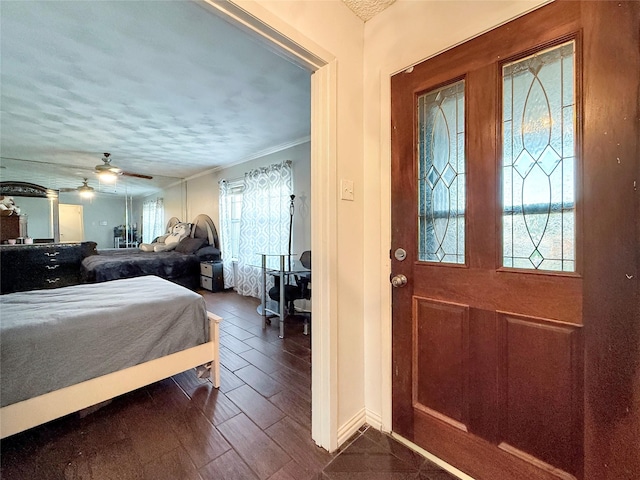 2725 Rustown Dr, Mesquite, TX 75150 - bedroom featuring ornamental molding, a ceiling fan, a textured ceiling, and baseboards