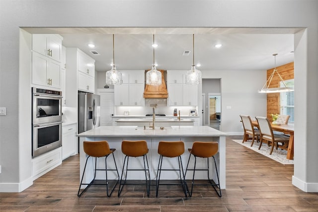 304 Red Roan Rdg, Weatherford, TX 76087 - kitchen with appliances with stainless steel finishes, baseboards, dark wood-style floors, and recessed lighting