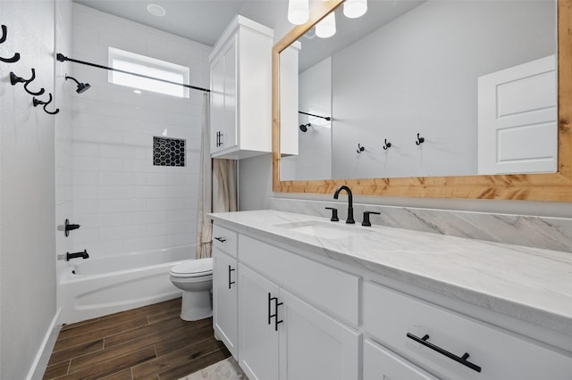 304 Red Roan Rdg, Weatherford, TX 76087 - bathroom with wood finished floors,  shower combination, vanity, toilet, and baseboards