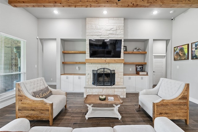 304 Red Roan Rdg, Weatherford, TX 76087 - living room with a stone fireplace, dark wood-style floors, recessed lighting, built in shelves, and beam ceiling