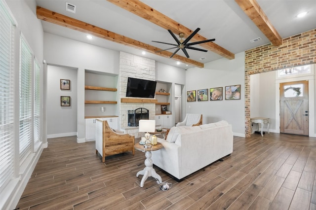 304 Red Roan Rdg, Weatherford, TX 76087 - living area featuring ceiling fan, plenty of natural light, beamed ceiling, baseboards, and wood finished floors
