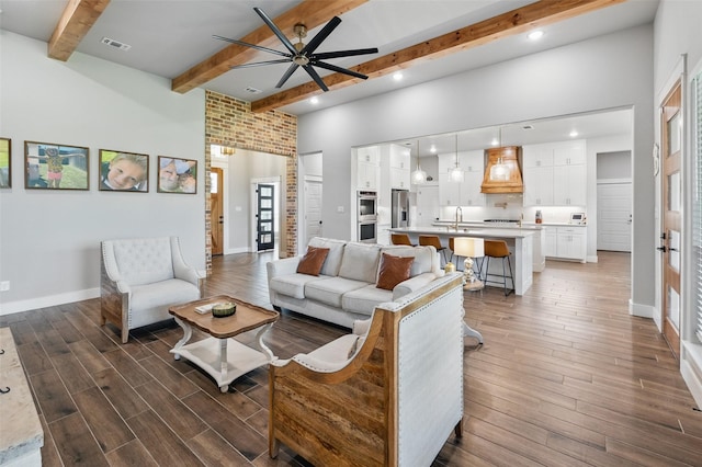 304 Red Roan Rdg, Weatherford, TX 76087 - living area with beam ceiling, ceiling fan, wood finished floors, recessed lighting, and baseboards