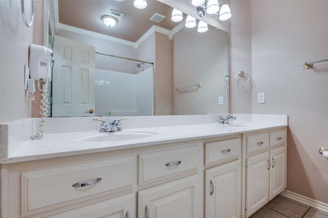 6506 Parkside Dr, Arlington, TX 76001 - bathroom with ornamental molding, double vanity, tile patterned floors, and a shower