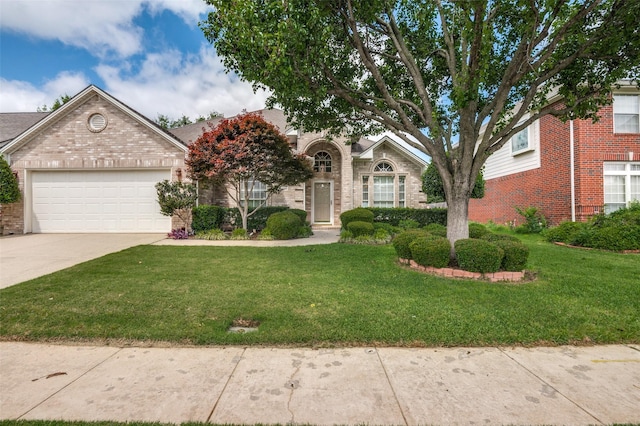 6506 Parkside Dr, Arlington, TX 76001 - view of front facade with brick siding, driveway, and an attached garage