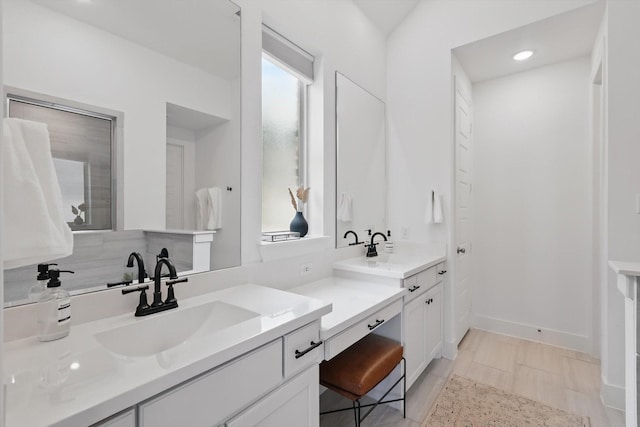 1809 Lithgow Rd, Celina, TX 75009 - full bathroom with double vanity, recessed lighting, and baseboards