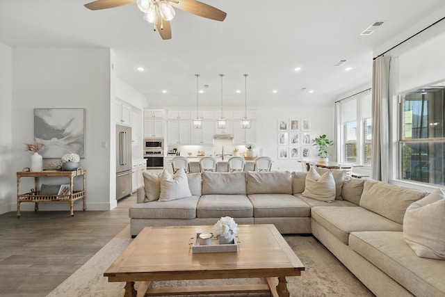1809 Lithgow Rd, Celina, TX 75009 - living area featuring light wood-style flooring, a ceiling fan, recessed lighting, and baseboards