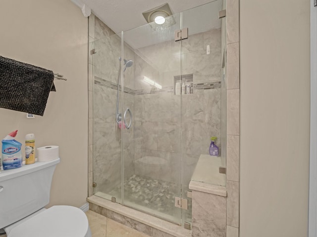 1824 Castille Dr, Carrollton, TX 75007 - bathroom featuring toilet, tile patterned flooring, and a stall shower