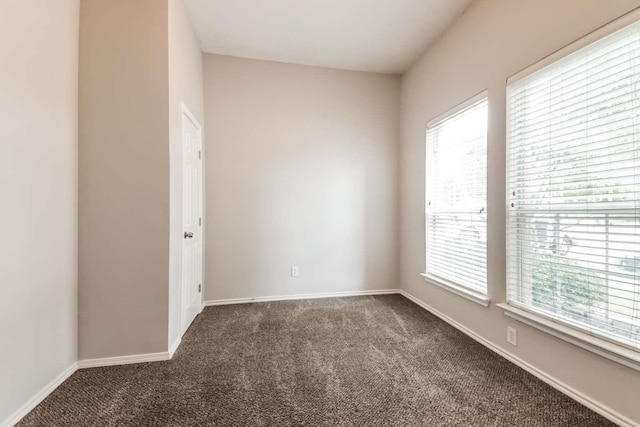 532 Chestnut Trl, Forney, TX 75126 - spare room with dark colored carpet, healthy amount of natural light, and baseboards