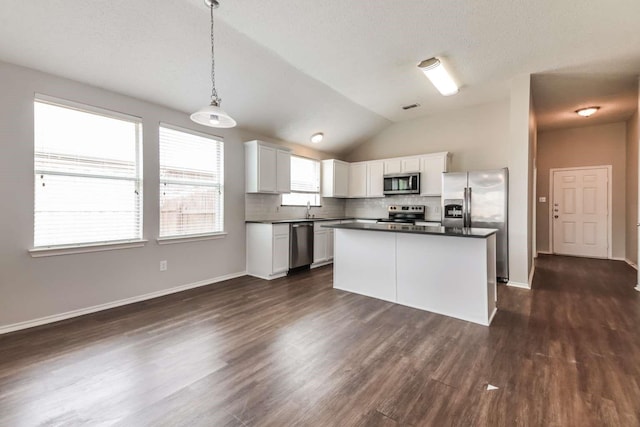 532 Chestnut Trl, Forney, TX 75126 - kitchen with appliances with stainless steel finishes, a sink, dark countertops, tasteful backsplash, and white cabinetry