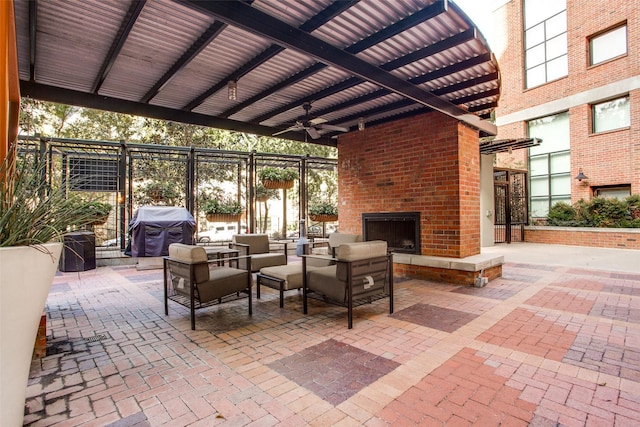 3110 Thomas Ave Unit 535, Dallas, TX 75204 - view of patio featuring grilling area, ceiling fan, and an outdoor living space with a fireplace