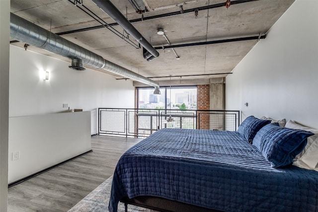 3110 Thomas Ave Unit 535, Dallas, TX 75204 - bedroom featuring wood finished floors