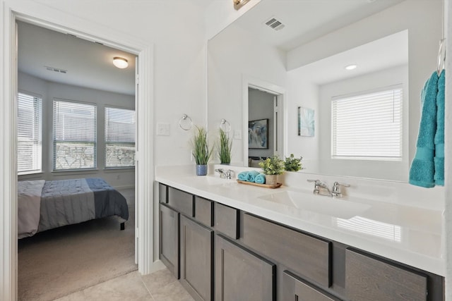 1012 Friesian Ln, Aubrey, TX 76227 - ensuite bathroom featuring double vanity and tile patterned flooring