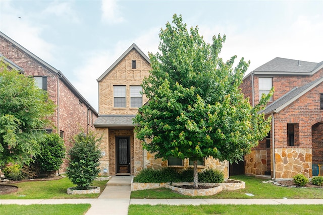 624 Ansley Way, Allen, TX 75013 - traditional-style house featuring a front lawn, brick siding, and stone siding