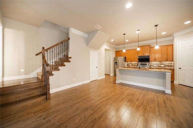 624 Ansley Way, Allen, TX 75013 - kitchen with stainless steel fridge, wall oven, crown molding, recessed lighting, and an island with sink