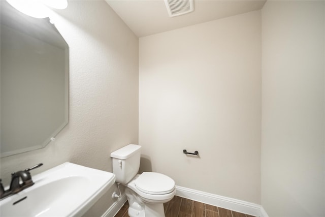 624 Ansley Way, Allen, TX 75013 - bathroom featuring wood finished floors, baseboards, toilet, and a sink