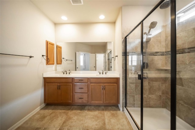 624 Ansley Way, Allen, TX 75013 - bathroom featuring double vanity, a shower stall, baseboards, and recessed lighting