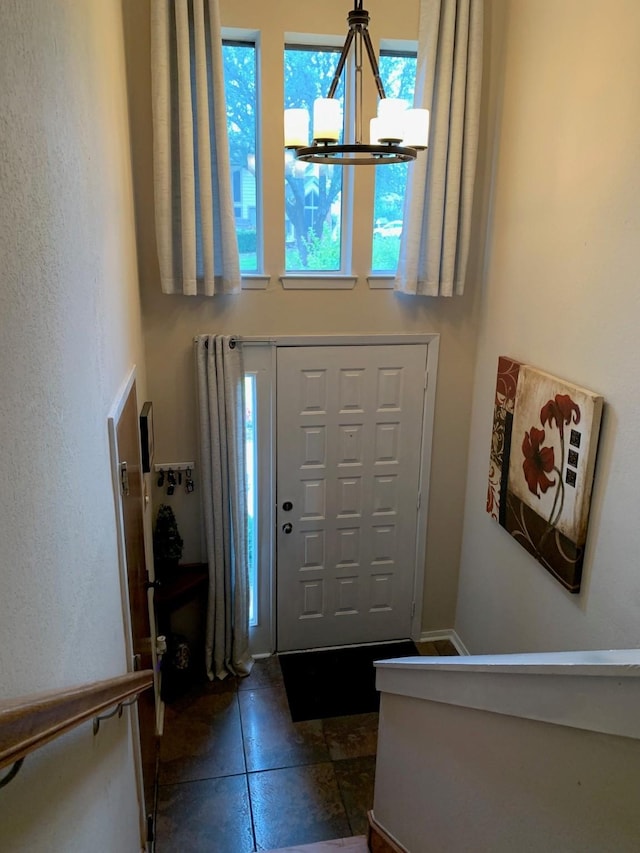 151 Summer Place Cir, Pottsboro, TX 75076 - foyer featuring a chandelier, healthy amount of natural light, and dark tile patterned flooring