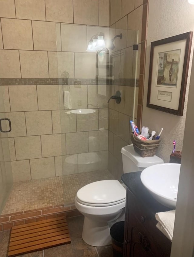 151 Summer Place Cir, Pottsboro, TX 75076 - bathroom with vanity, a stall shower, toilet, and a textured wall