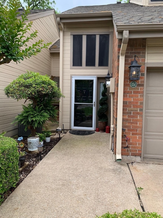 151 Summer Place Cir, Pottsboro, TX 75076 - doorway to property featuring brick siding and an attached garage