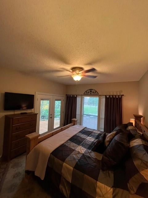 151 Summer Place Cir, Pottsboro, TX 75076 - bedroom featuring access to exterior, a textured ceiling, ceiling fan, and french doors